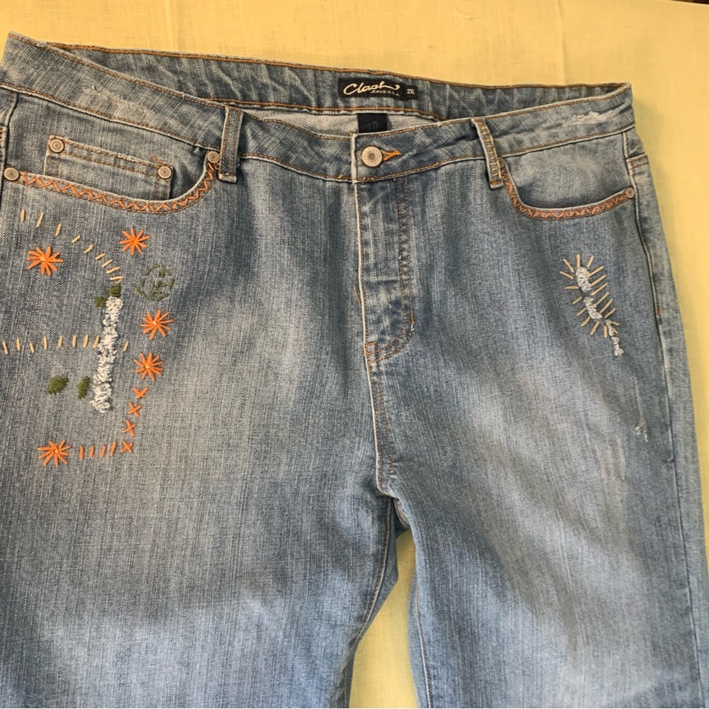 Clash faded distressed embroidered front and back of jeans. Plus size 2X